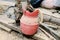 An old, rubber jug in cobweb in an abandoned attic. Horizontal photo