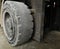 Old rubber wheel forklift truck after use for a long time