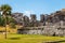 Old ruined ancient Mayan temples with palm tree and blue sky, Tu