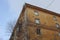 The old ruined building with dirty broken Windows on the figured facade is a historical monument