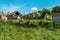 Old ruined houses with back yards in grass