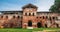 Old ruins of a medieval abandoned ruined red brick castle or Orthodox temple