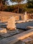 Old ruins and stones carved in the old greek language at the archeological site near Aliki Marble Port on Thasos Island, Greece