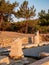 Old ruins and stones carved in the old greek language at the archeological site near Aliki Marble Port on Thasos Island, Greece