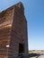 An Old Rundown Grain Elevator with Train Tracks