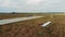 Old runway in the fields with a small jet landing on it