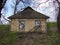 Old rural house with boarded up windows