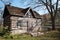 Old rural log cabin with view of river