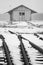 Old, rural railroads and railway station in winter