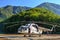 Old Russian helicopter MI-8 stands on landing pad in green Caucasus mountain forest and ready for flight