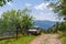 Old russian jeep parked next to wooden fence on the mountain dirty road. Summer day. Mountain tour