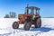 Old Russian tractor in snow