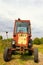 Old Russian tractor in the yard of a farm