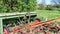 Old, rusted and abandoned farming machinery on a fruit farm