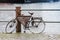 Old rusted bicycle is on an embankment