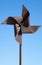 Old rusted metal wind whirligig