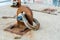 Old rusted shackle anchoring device on a concrete surface