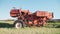 Old rusted tractor aged on farm land. Abandoned agricultural machinery