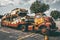 Old rusted truck hauler with rusted classic cars in Colonial Heights, USA