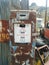 Old, rusted vintage gas pump in the desert