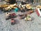 Old, rusted vintage toy vehicles on the ground