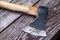 Old rustic axe with steel head and wooden haft