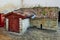 Old rustic building of stone with a tiled roof with moss