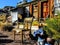 Old Rustic Chair Outside Shack with Antique junk all around