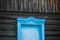 Old rustic closed wooden window in countryside house. Selective focus