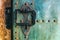 Old rustic copper castle metal door with large knocker