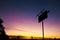 Old rustic fuel station sign as a silhouette.