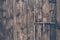 Old rustic and grunge wood texture door close up with bolt