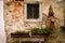 Old rustic house facade texture with orange bricks and old rusty accessories