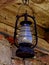 Old rustic lamp hanging under the roof
