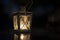 Old rustic lantern in the darkness