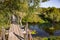 Old rustic pedestrian bridge across the Protva River