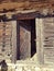 Old rustic rural wood door of a traditional Romania  wood house. Fundata mountains