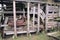 Old rustic timber storage hut with rusty machinery