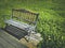 Old rustic vintage wooden bench in summer cosmos flowers field Background . Spending time among nature on holiday concept idea