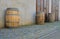 Old rustic wine barrels in front of modern wine cellar. Wine background in Europe. Czech Republic, South Moravia