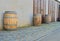 Old rustic wine barrels in front of modern wine cellar. Wine background in Europe. Czech Republic, South Moravia