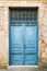 Old rustic wooden doors painted in blue