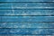 Old rustic wooden planks with blue cracked paint, vintage wall wood for background