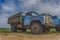 Old rusting truck or lorry outdoors in a field