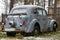 Old rusty abandoned car in the forest. Lost Old russian auto