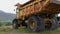 Old rusty abandoned dump truck close up