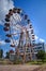 Old rusty abandoned Ferris wheel in the amusement park in Ochamchira, Abkhazia