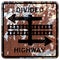 Old rusty American road sign - Divided highway transit rail crossing