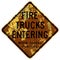 Old rusty American road sign - Fire trucks entering when signal flashes, Wisconsin