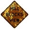 Old rusty American road sign - Hill blocks view